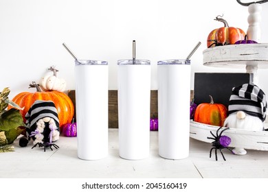 3 blank white sublimation tumblers with halloween decor, skinny drinkware mockup
