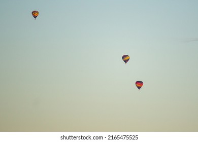 3 Colorful Hot Air Balloons Fly At Sunset In Snohomish County Washington During The Summer