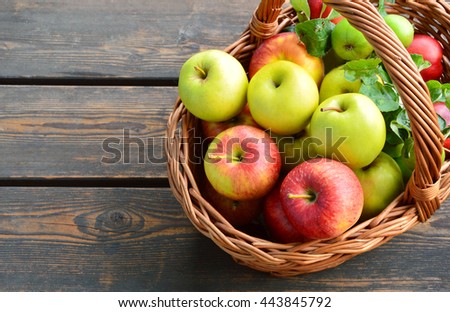 3 Different kinds of apples and the tasty benefits of each.
colorful and various kinds of apples in the basket on wooden background.