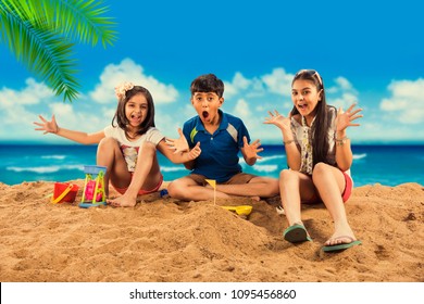 3 Indian/Asian Kids Playing At Beach Sand