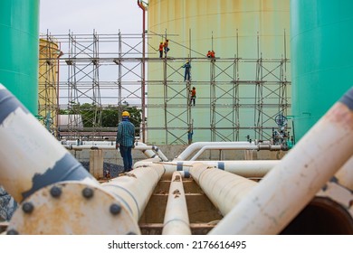 3 July 2022 Saraburi Thailand Worker Male Assembly In Progress Scaffolding Tank Oil Pipeline Inspection Work At High.