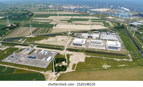 3 June 2022, Eemshaven, Holland. Aerial View Of New Datacenter Of Google Alphabeta Near Delfzijl In The Province Of Groningen. Behind The Blue RWE Power Plant. On The Clear Horizon Sea Waddenzee.