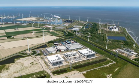 3 June 2022, Eemshaven, Holland. Aerial View Of New Datacenter Of Google Alphabeta Near Delfzijl In The Province Of Groningen. Behind The Blue RWE Power Plant. On The Clear Horizon Sea Waddenzee.