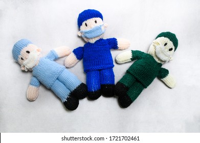 3 Knitted Front Line Workers On White Background. Covid 19