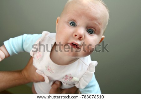 Similar – Little baby girl with funny surprise expression on her face