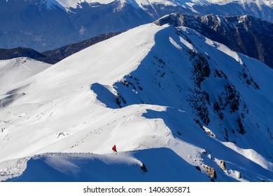 3 Mountain Climbers Walk On Snow In The Mountains