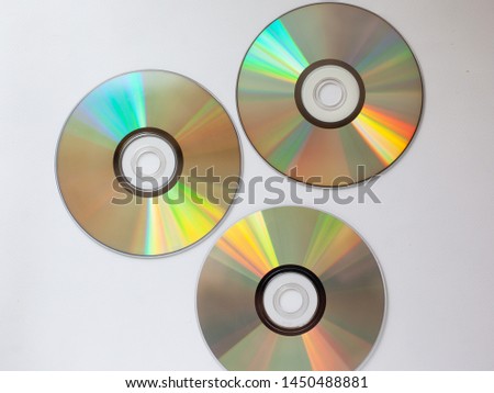 3 scattered cd compact disk with music on a white background close-up
