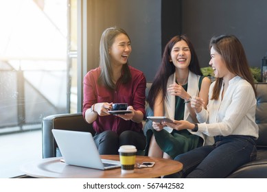 3 Teenagers Friends Meet In Coffee Shop, Using Technology Device Have Fun