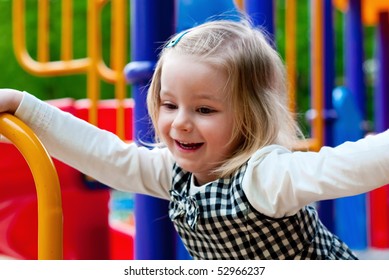 A 3 Year Old Girl In Playground Equipment