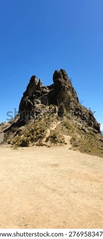 30 April 2023. Dramatic view of Muela del Diablo (“Devil’s Molar”) near La Paz at an elevation of 3,852 meters, featuring rugged sandstone spires and eroded formations rising above the Andean landscape, with panoramic views of the surrounding mountains and the city below under clear blue skies.