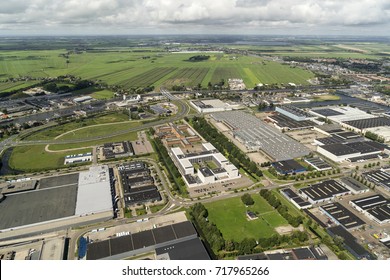 30 July 2017, Alphen Aan Den Rijn, Holland. Aerial View Of Prison, Industrial Area And A Clear Horizon With Green Fields, Meadows And Beautiful Clouds.