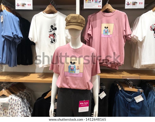 30 May 2019; Bangkok Thailand: Interior of Woman Mickey Mouse T-shirts Zone at Uniqlo Store, Retail textile shop.