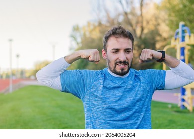 30 Year Old Adult Man Showing His Sports Progress To His Presonal Coach During An Online Training. Concept Of Overcoming, Attitude, Strength, Overcoming, Strength And Healthy Outdoor Life.