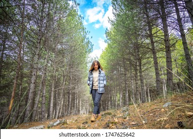 30 Year Old Woman Walking Through The Woods