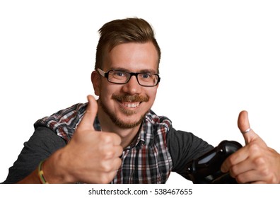 30 Years Old Attractive Guy Show Like And Keep Joystick In One Hand. Happy Gamer Shot Isolated On White Background. Handsome European Man