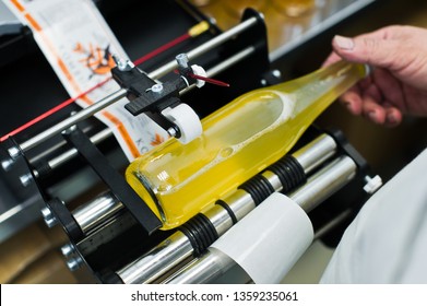30.03.2019 Russia, St. Petersburg - Moving Bottles on Labelling machine for Industry, food industry, conveyor line
