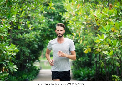 30-35 Year Old Caucasian Male Jogging In The Park