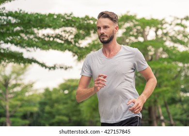 30-35 Year Old Caucasian Male Jogging In The Park