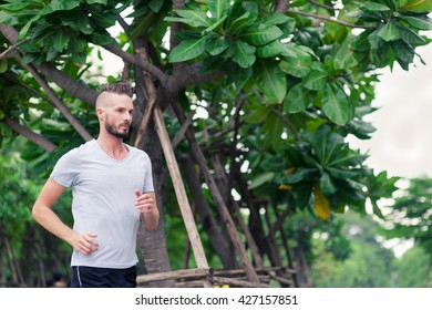 30-35 Year Old Caucasian Male Jogging In The Park