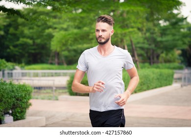 30-35 Year Old Caucasian Male Jogging In The Park