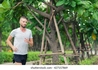 30-35 Year Old Caucasian Male Jogging In The Park