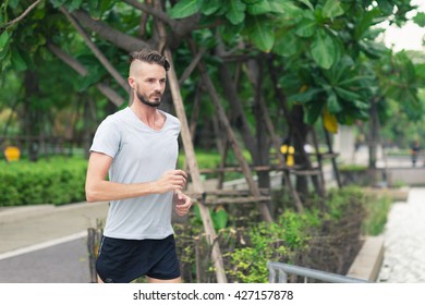 30-35 Year Old Caucasian Male Jogging In The Park