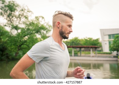 30-35 Year Old Caucasian Male Jogging In The Park