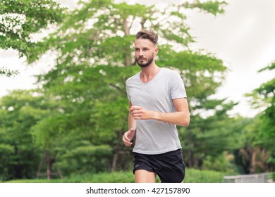 30-35 Year Old Caucasian Male Jogging In The Park