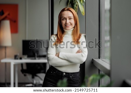 30s 40s business woman portrait. Successful modern executive in an office. Mid aged entrepreneur.