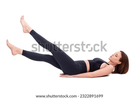 30s Caucasian fit woman doing flutter kicks exercise in sportswear, isolated on white color