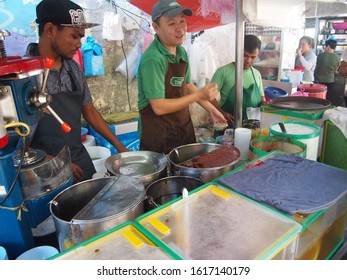 30th December 2019, Georgetown, Penang, Malaysia - A Cendol Hawker Stall Owner Is Taking Some Order For His Customer. 