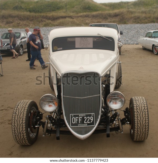 30th June 2018- A\
vintage Ford coupé hot rod parked on the sandy beach at Pendine,\
Carmarthenshire, Wales,\
UK.