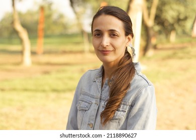 30-year-old Hispanic Woman, Long Straight Hair, With A Calm Look