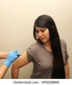 30-year-old Latin Woman Happy And Scared With The Covid-19 Vaccine Shot
