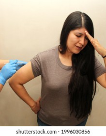 30-year-old Latin Woman Happy And Scared With The Covid-19 Vaccine Shot
