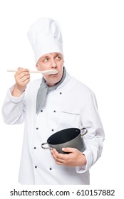 30-year-old Novice Cook Eat With A Spoon From The Pan On A White Background