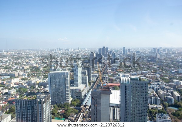 31 January 2022,\
Bangkok,Thailand. High building around main skytrain public\
transportstion. Urban living is high demand resident and property\
closely railway station