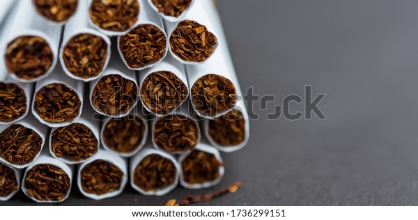 31 May of World No Tobacco Day, Close up front\
stack pile cigarette or tobacco on black background with copy\
space, Warning lung health\
concept