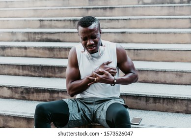 A 31 Year Old African American Man With Black Skin He Is And Athlete, He Is Having Pain In The Chest Due To Heart Disease, After He Exercised By Running Up And Down The Stairs, To Health Care Concept