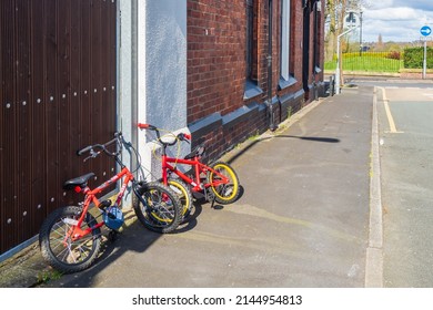 31.03.2022 St Helens, Merseyside, UK. Kids Cycles Left Outside Their Homes On The Street Pavement