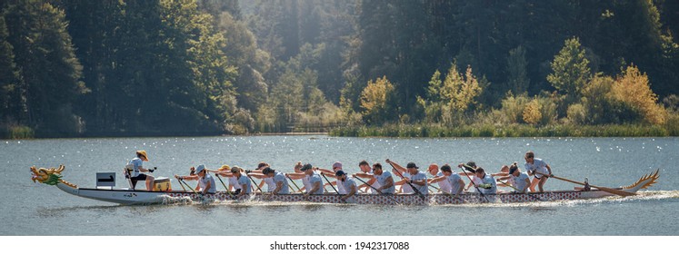 31.08.2019 Ukraine. Zhytomyr. Dragon boat races on colorful boats original from China traditional Chinese paddled watercraft activity. Life before pandemic Covid-19