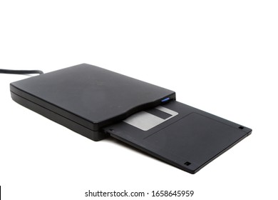 A 3.5" floppy disk and drive isolated on a white background