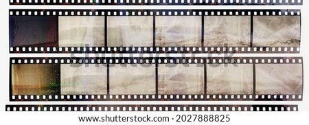 35mm positive filmstrips with empty frames, real scan of film material with cool scanning light interferences on the material. retro photo placeholder.