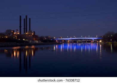 35W Bridge Spanning Mississippi River In Downtown Minneapolis Illuminated By Blue Lights At Dusk