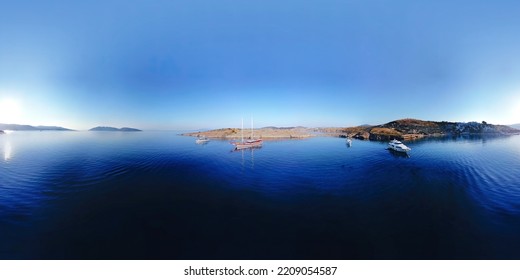 360 Degree Sailing Ship Yachts At Opened Sea. View To Sailboat. View Of Anchoring Yacht In Open Water. Ocean And Sea Travel Panorama