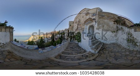 Similar – On the left, part of Gaeta Cathedral (Italy) On the right, an old building and the silhouette of an umbrella line. In between the view of the old town and the port of Gaeta.