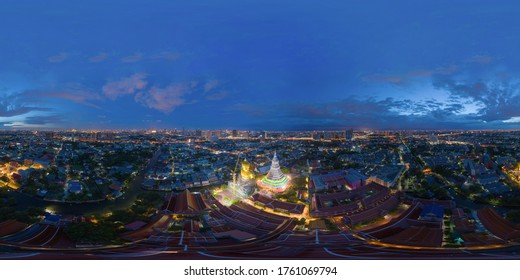 360 panorama by 180 degrees angle seamless panorama of aerial view of the Giant Golden Buddha in Wat Paknam Phasi Charoen Temple in Phasi Charoen district at night, Bangkok. Urban town, Thailand.