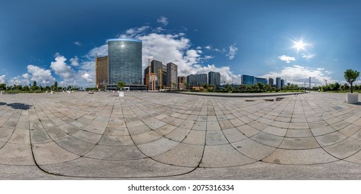 360 seamless hdri panorama view on square near seashore or ocean with skyscrapers with blue sky and good weather in equirectangular spherical projection, ready AR VR virtual reality content