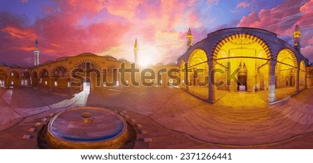360-degree view of Uc Serefeli Mosque courtyard of Edirne in Turkey. Elegant minarets and intricate arches are beautifully illuminated by sunset light, enhancing the magnificent Ottoman architecture.