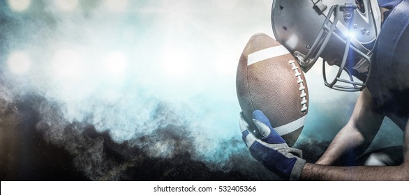 3D Close-up of upset American football player with ball against digitally generated image of color powder - Powered by Shutterstock